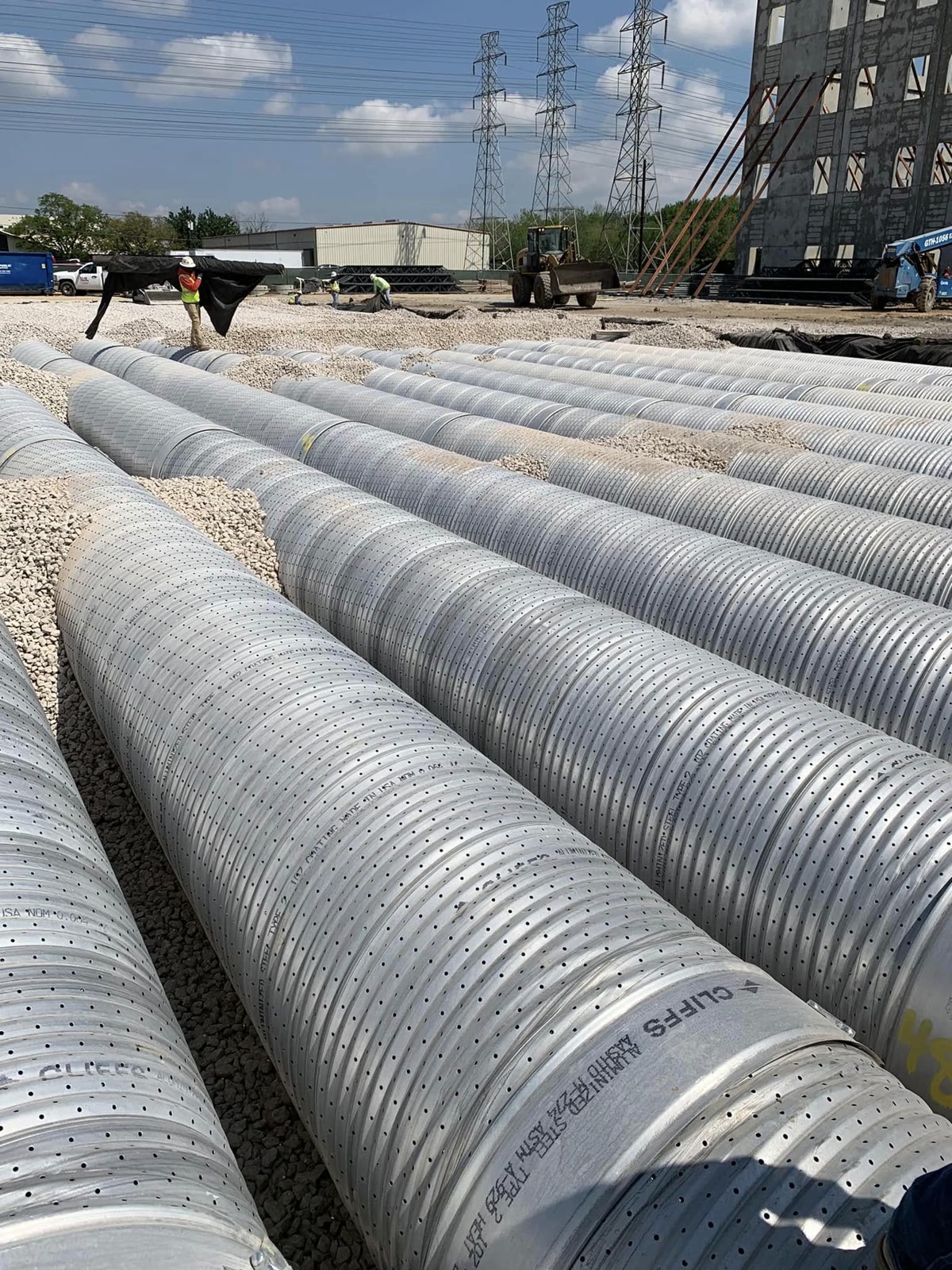 Storm sewer pipes staged for installation